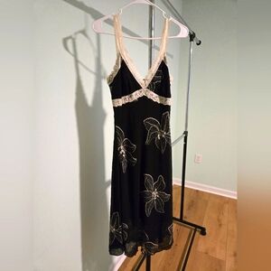 Lipstick dress, black with ivory flowers. Medium